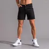 Shorts Shorts Summer Jogging Man Sport Pants Short Gym Dry Cargo Pocchi di allenamento maschi