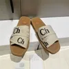 Zapatillas de mujer de lujo de diseñador Sandalias con logotipo de Woody Mulas Chanclas planas marrones Chanclas con caja