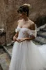 Robes de mariée romantiques sexy Une ligne Illusion dos nu chérie perlée robe de mariée plis à plusieurs niveaux tulle étage longueur robes de mariée sur mesure