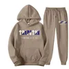 Мужские спортивные костюмы 2023 бренд Trapstar Printed Sportswear Men 15 Colors Теплые две части складывают брюки для толстовки с капюшоном.