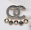 Women Brand Designer Double Letter Brooches Black Tassels Pendant Rhinestone Diamond Crystal Circle Metal Brooch Suit Laple Pin Fashion Women Jewelry Accessories