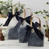 Sacs d'emballage en PVC souple noir fourre-tout avec boucle à main grand sac à main en plastique avec nœud en ruban pour le paquet de cadeaux du Festival de Noël