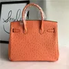 Diseñador de bolsos de platino Ostrich Bolsa de patrón de moda Portable Un hombro que inclina a la piel de vaca de cuero genuino de color naranja para mujeres