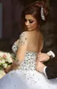 Spring Luxury Crystal Wedding Dresses Bridal Gowns With Crystal Beads A Line Sheer Illusion Crew Neck Long Sleeves Floor Length Arabic