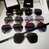 Trendig designer Rimless Solglasögon Låsande bokstäver Ikon Solglasögon Personlighet Män kvinnors glasögon med låda