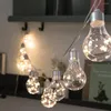 Stringhe luci a stringa in stile lampadina a LED trasparenti alimentate a batteria in PVC lampade da fata per interni albero di Natale decorativo per la casa
