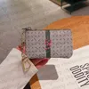 Titulares de cartão de luxo das mulheres dos homens das mulheres carteiras chave designer moda moeda bolsa titular do cartão de couro com zíper saco accessoires m62650