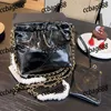 CC Bags Luxury Brand Axel Trend Gold Coin Women Classic Buckle Garbage Bag med Clutch Pearl Leather Mini Handbag Crossbody Metal P