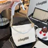 CC Bags Luxury Brand Axel Trend Gold Coin Women Classic Buckle Garbage Bag med Clutch Pearl Leather Mini Handbag Crossbody Metal P