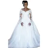 Abito da sposa con applicazioni di pizzo floreale africano vintage 2023 Illusion Abiti da sposa a maniche lunghe con perline Cappella treno Abiti da sposa avorio Vestido De Novia