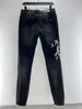 2023 Mens Designer Jeans Ejressad Ripped Biker Jean Slim Fit Motorcykelcyklister denim f￶r graffiti Tryck m￤n S Fashion Mans Black Pants