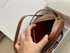 Luxurys Designers TRIOMPHES Mini Oval Crossbody bag womens round handbags totes pochette Genuine Leather bag Mens top quality fashion clutch shoulder bags