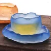 glass tea cup and saucer