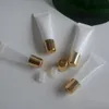 Toptan PE Kozmetik 10ml 15ml Dudak Parlatıcı Tüp Sıkıştırma Mini Şişeler Plastik Tüpler Altın Kapak İletişim Yağı Balsamı Dökme