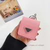 Fashion Desinger AirPods Case Sac à dos style 4 couleurs AirPods Package avec motif triangle inversé avec porte-clés Xinjing03