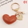 Femmes cuir coeur amour porte-clés métal couleur or perle porte-clés sac pendentif accessoires pour femmes porte-clés bijoux