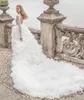 Incredibili abiti da sposa a maniche lunghe in pizzo con scollo a V profondo abiti da sposa senza schienale Una linea a strati con spacco laterale in tulle robe de mariee