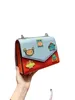 Women's Designer Bags 22 New Cartoon Robot Color Matching Chain Postman Single Shoulder Messenger Bag p Badge Letter Leisure Small Square Bag Factory Direct Sales