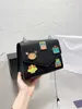 Women's Designer Bags 22 New Cartoon Robot Color Matching Chain Postman Single Shoulder Messenger Bag p Badge Letter Leisure Small Square Bag Factory Direct Sales