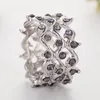 Anillos de boda Diseño Infinito Cruz entrelazada Púrpura CZ Anillo de piedra Interés especial Forma de onda hueca Vine Mujeres Dedo Banda ancha