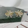 Stud -oorbellen Charm vlinderdas geplaveid Volledig zirconia modemerk vrouwen luxe bruiloftsfeest sieraden handgemaakte koperen oorrang