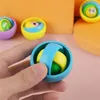 يدوي الدوار لعبة البلاستيك المعادن ثلاثية الأبعاد المغازل قوس قزح الدوران الدوران الدوران توب ألعاب إصبع العين للعين للأطفال.