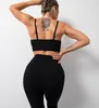 Leggings da donna adatti a due pezzi abiti da yoga tuta di design Texture tinta unita Bretelle top e pantaloni Sollevamento glutei Abbigliamento sportivo forza elastica Abbigliamento da palestra