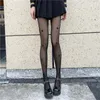 Kvinnors strumpor Kvinnors svarta Lolita -stjärna tryck sömlösa ren strumpbyxor tights japanska sexiga mesh plus storlek fisknät strumpning gotisk strumpor