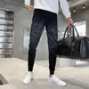 Herenjeans Lente-aankomst Heren Slanke wassing Middentaille Fit Koreaanse stijl Elastisch patroon Mode Mannelijke Hommo Man Potloodbroek