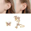 Dos boucles d'oreilles mode creux pleine perceuse femmes papillon asymétrique oreille os Clip bijoux