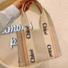 Canvas Cloee Bag Woody outlet Bags Designer Shoulder Handbag Hands 2024 Tote Fashion One Niche Design Portable Large Tote Women's Ca AK46