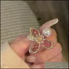 Anelli a grappolo Anelli a grappolo Design Gioielli di moda Esagerato Anello di perle di fiori di cristallo rosa Anello di perle di lusso lucido da donna Apertura regolabile Dhv4N