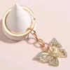 Keychains 2022 модная тенденция Color Butterfly Butterfly Keychain Drip Charm рюкзак подвесной кулонный автомобиль аксессуары оптом прямые продажи