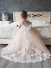 Lovely 3D Floral Applique Flower Girls Dresses Cross Straps Backless Communion Party Gowns Puffy Tulle Birthday Ball Gown Girls Pageant Dress MC2300-2309