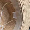 Breite Krempe Hüte französische elegante Perlenkette Luxus Raffia Flach Top Stroh für Frauen handgefertigte Dame Summer Beach Cap Sun Visor