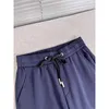 Pantalones de primavera elastics dise￱ador de lujo para hombres y huellas de mujeres pisos pellizcados icono peque￱o pantalones de cintura azul marino