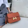 2023 Sacs à main Clearance Outlet Vente en ligne Classique bouton magnétique petit sac carré épaule messager portable en cuir synthétique fronde unique épaule qui peut être