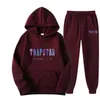 Tuta TRAPSTAR Tuta sportiva stampata Uomo Colori Caldi Due pezzi Set Felpa con cappuccio allentata Pantaloni streetwear Y2211