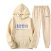 Tuta TRAPSTAR Tuta sportiva stampata Uomo Colori Caldi Due pezzi Set Felpa con cappuccio allentata Pantaloni streetwear Y2211