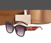 2023 1ps ​​O occhiali da sole da sole da sole da sole Designer maschile casi marroni da donna telaio nera telaio scuro da 50 mm per0059 per0059