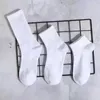 Mens socks Wholesale Sell All-match Classic black white Women Men Breathable Cotton mixing Football basketball Sports Ankle Long sock