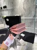 2022 Nuova mini borsa a catena smaltata da donna litchi logo smaltato portatile in pelle di mucca