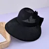 ワイドブリム帽子2023女性の大きな麦わら帽子と弓ファッション空のトップフロッピーサンサマー折りたたみ折りたたみ折りたたみ式