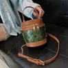 Bolsas de ombro de ombro de couro para crianças bolsas de corrente de estampa de flores com estampa de balde circular bolsas de moeda de moedas de mensageiro