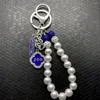 Porte-clés ZETA PHI BETA Sorority Society Strass Pendentif en métal en forme de coeur Chaîne de perles blanches Porte-clés