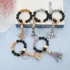 Schlüsselanhänger Leopard Schlüsselanhänger Armband Quaste Holzperlen Anhänger Schlüsselanhänger für Frauen Schlangendruck Runde Charms Großhandel