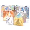 Present Wrap Laser Present Paper Bag Holiday Party Gold and Silver Packaging Carton Ribbon Small kan anpassas storlek Print 2211087303031