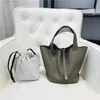 Borsa di design nuova testa in pelle modello litchi borsa da donna bottone oro cesto di verdure secchio moda semplice mano per il tempo libero