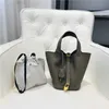 Borsa di design nuova testa in pelle modello litchi borsa da donna bottone oro cesto di verdure secchio moda semplice mano per il tempo libero