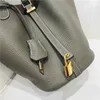 Borsa di design nuova testa in pelle modello litchi borsa da donna bottone oro cesto di verdure secchio moda semplice mano per il tempo libero